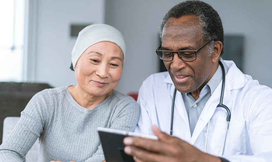 pancreatic cancer doctor and patient looking at tablet
