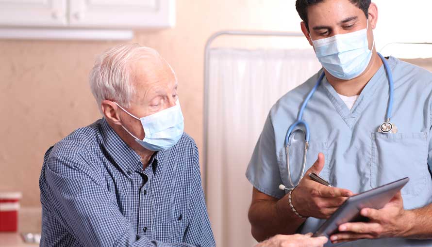 A doctor shows information to a patient