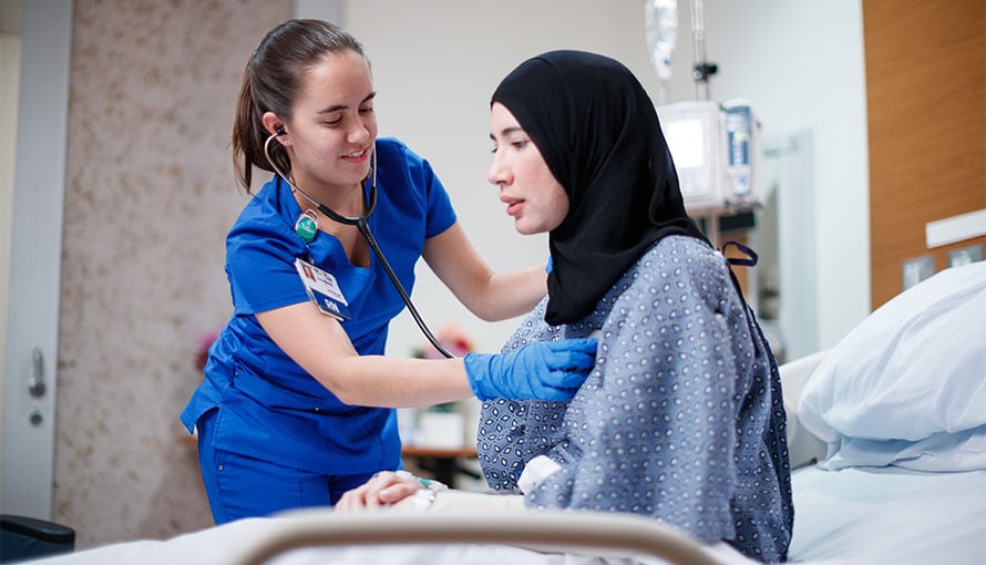 nurse treating patient