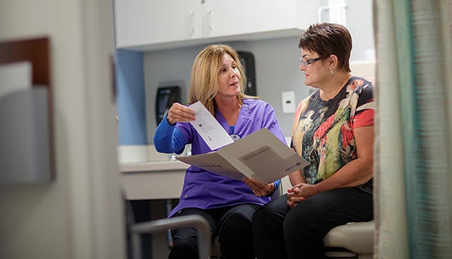 Doctor talking to patient about cervical cancer