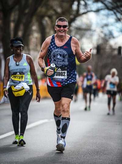 Vinny O’Shaughnessy pushed through the pain of broken ribs sustained in a training fall to run the 26.2 miles of the Boston Marathon.