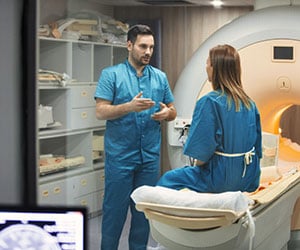MRI tech explaining procedure to patient
