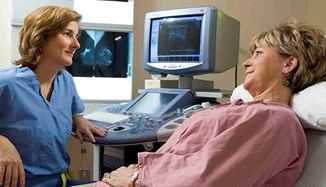 A patient beside an ultrasound machine