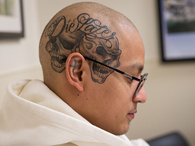 Raphael Misael has over 20 tattoos. His newest one one his scalp reads "Die Later."