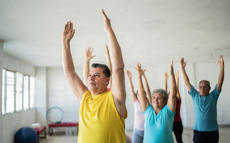 man doing yoga at studio