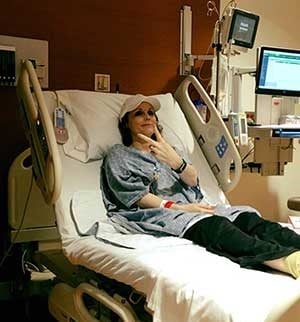 Moffitt patient Tina Cancio in her hospital bed