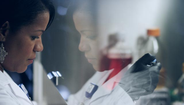 researcher studying colon cancer clinical trial