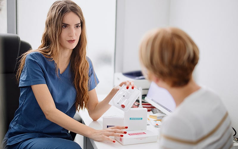A Medical Assistant talks to a patient