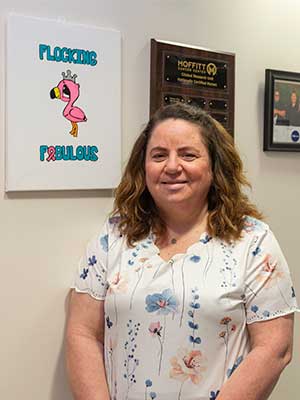 Stout's painting of a flamingo hangs as inspiration at Moffitt's McKinley Campus.