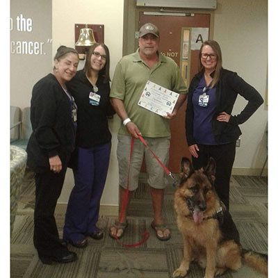 Cella with his nurses and dog, Boru, on his last day of radiation