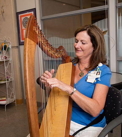 woman playing harp