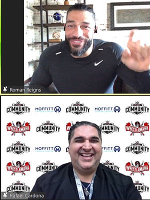 Moffitt team member Rafael Cardona with Roman Reigns