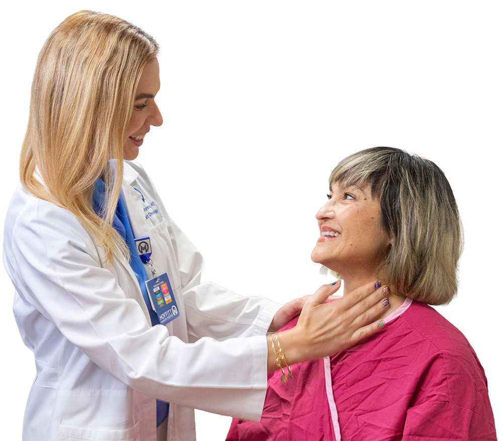 A doctor examines a woman's throat