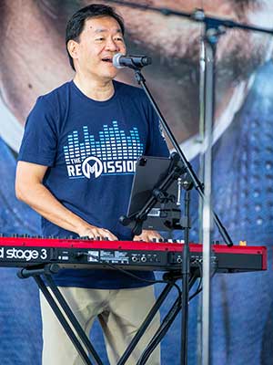 Dr. Patrick Hwu, President and CEO, Medical Oncologist, Researcher, Keyboard