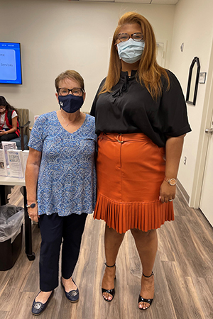 Susan Brill, left, stands with Tasha Swafford near the mastectomy fitting suite at Moffitt Cancer Center.