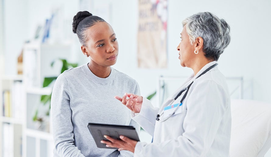 Patient getting a consultation for a cervical cancer biopsy