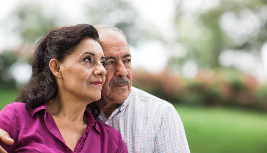 A man and woman looking hopeful