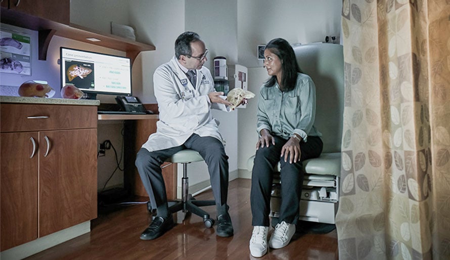 Dr. Anaya discusses liver cancer with patient