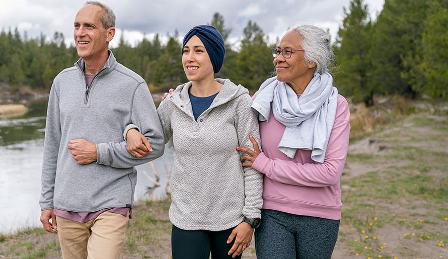 Female with melanoma which has spread walking with family