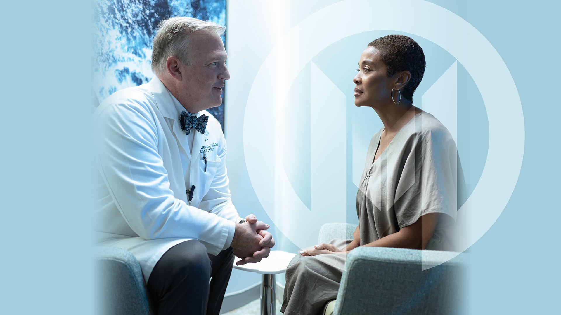 A Moffitt doctor talks to a patient