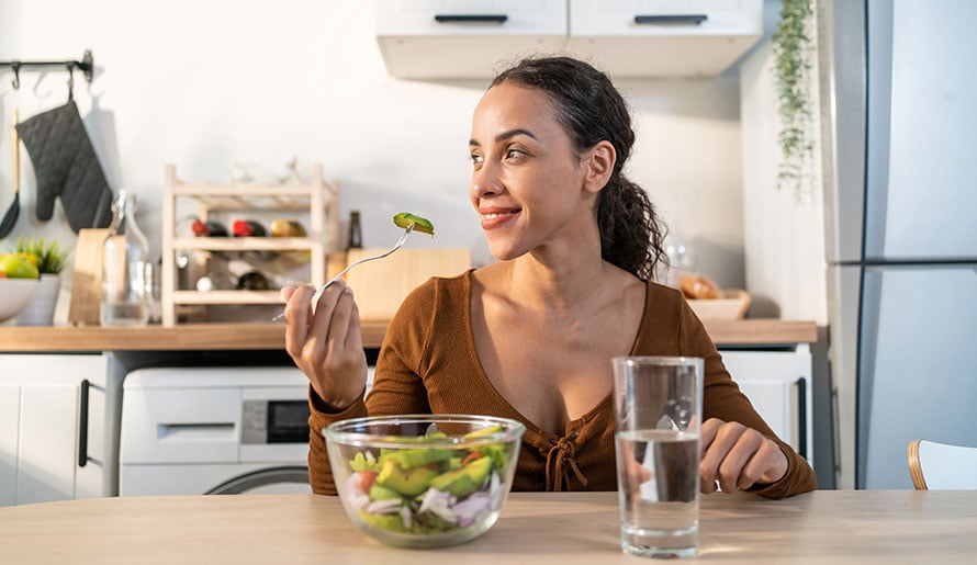 Woman eating healthy fruits and vegetables
