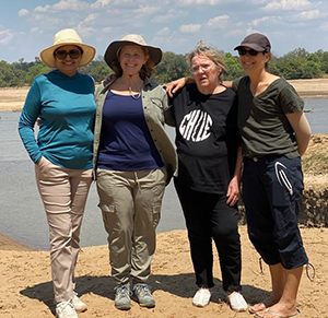 (L-R) 'MBC Sisters' Zaleena Zikria, Robin Hesselink, Marilyn Masick and Jenn Dillard visited Zambia, Africa, together in September 2021.