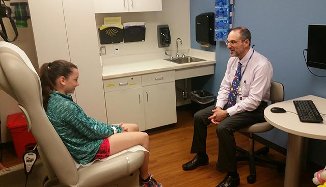 Dr. Sondak and a pediatric melanoma pateint