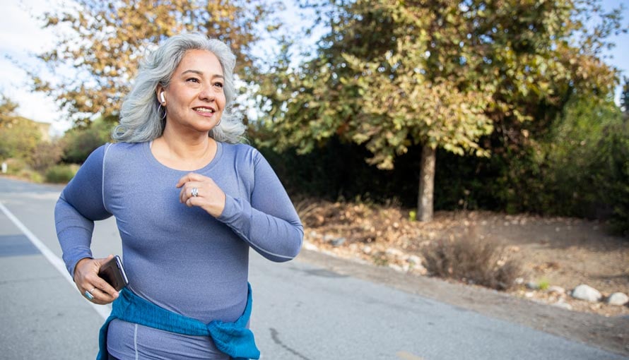 An older woman running for her health