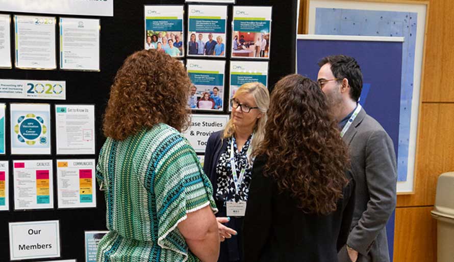 staff members looking at posters