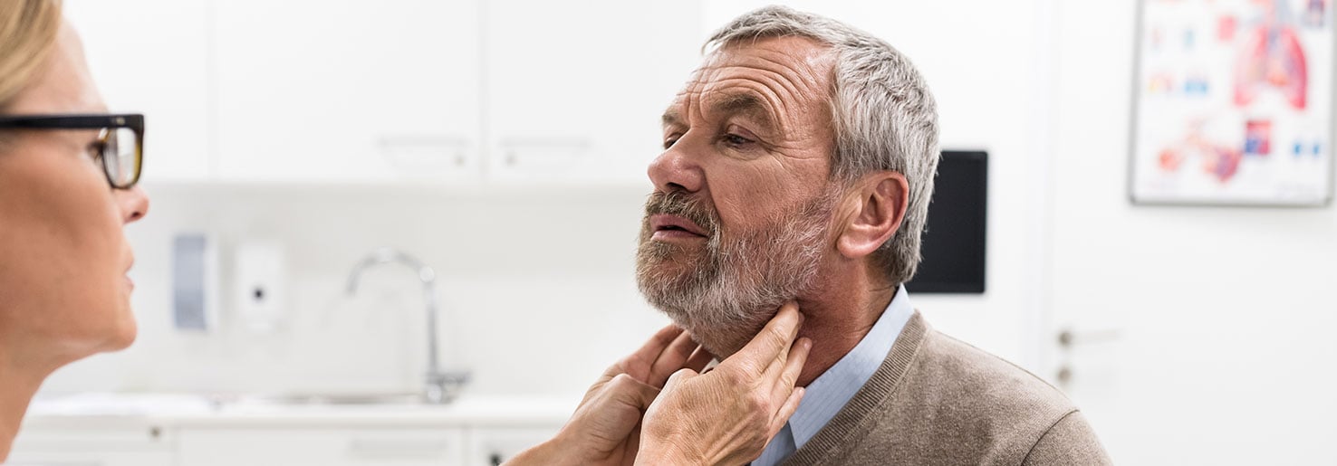 Doctor checking for signs of lymphoepithelial carcinoma signs