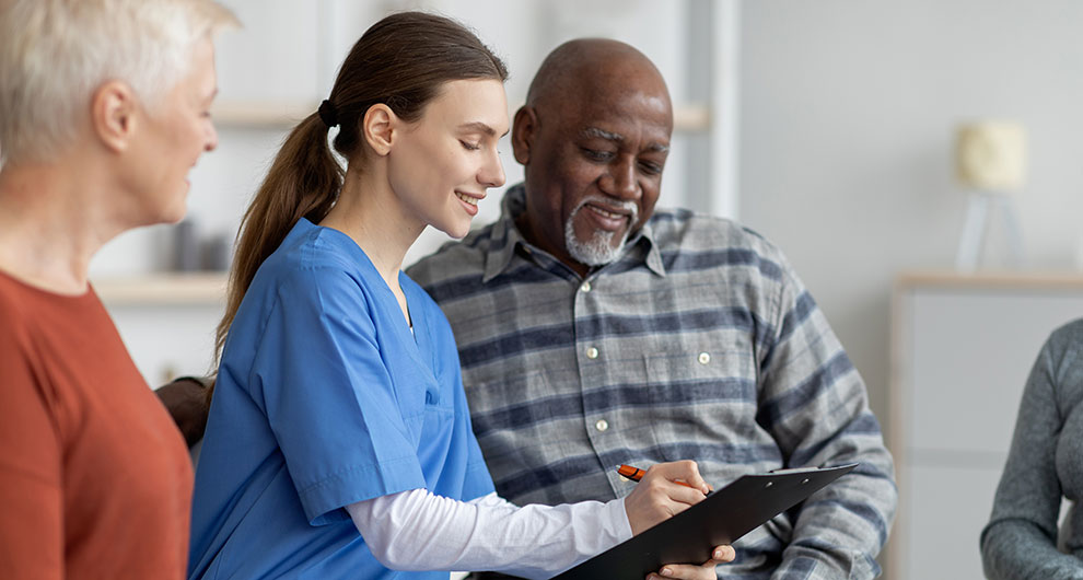 nurse discussing targeted therapy with patient and his wife