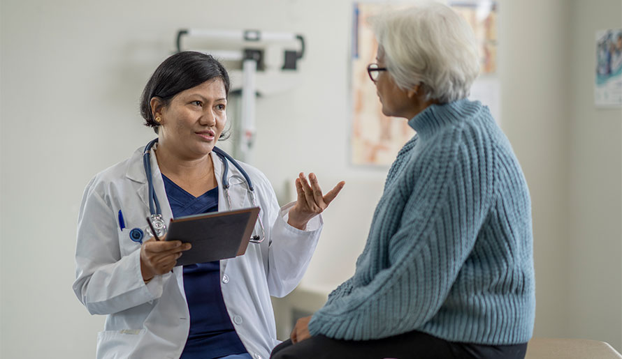 Woman talking to doctor about anal cancer