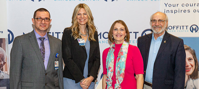 U.S. Rep. Kathy Castor poses with Dr. Issam El Naqa, Dr. Dana Rollison and lung cancer survivor Ed Cutler.