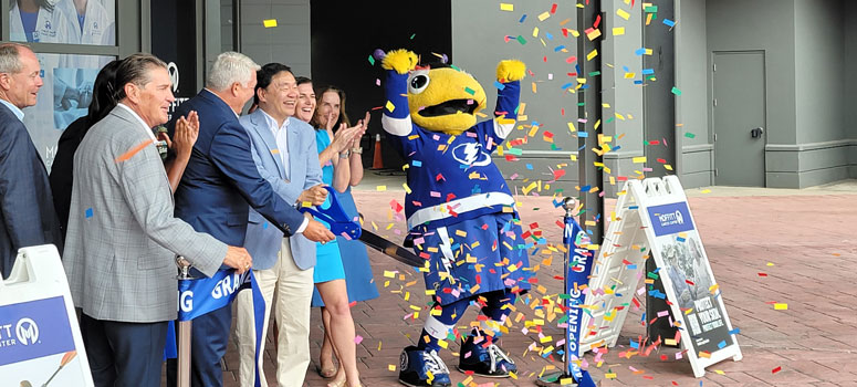 Officials from Moffitt Cancer Center, Port Tampa Bay, Tampa Bay Lightning Foundation and state of Florida gather for the grand opening of Moffitt Cancer Center at Port Tampa Bay.