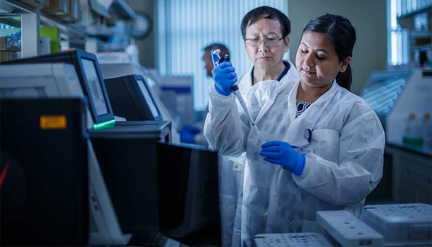 researchers in Moffitt laboratory