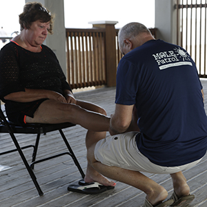 A woman is screened for skin cancer at the 2021 Pier 60 event.