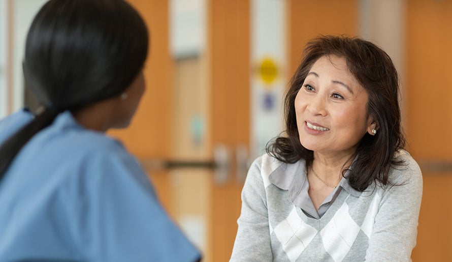 Nurse discussing large cell keratinizing squamous cell carcinoma with patient