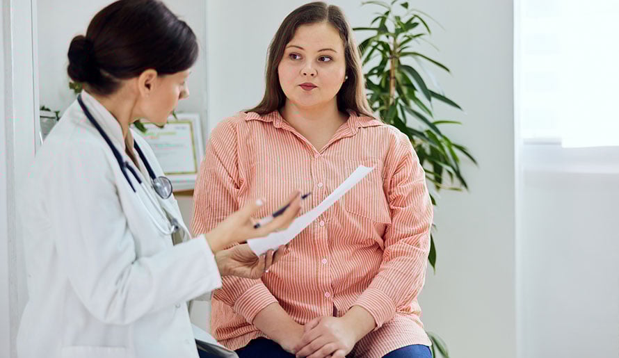 Doctor talks to patient undergoing liver cancer treatment