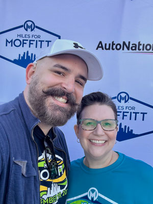 UNITY co-chair Justin Hall with Moffitt patient and breast cancer survivor Stacey Bowman at Miles for Moffitt 2022. 