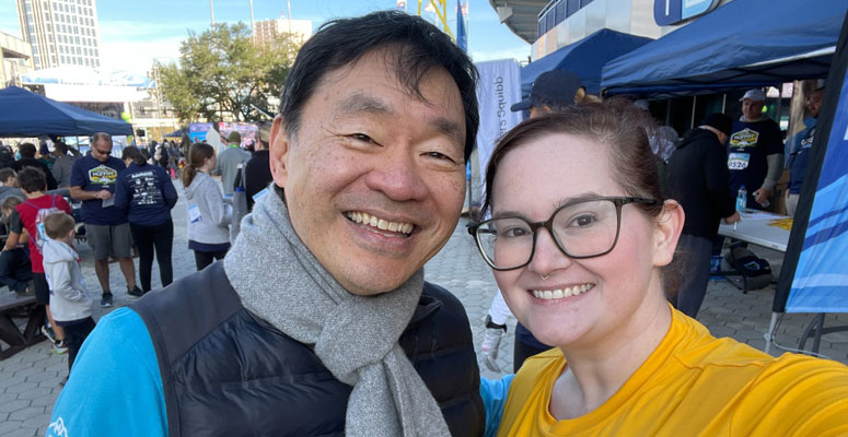 Laura Bosselman, UNITY chair, snaps a selfie with Dr. Patrick Hwu, Moffitt president and CEO, at Miles for Moffitt last year.