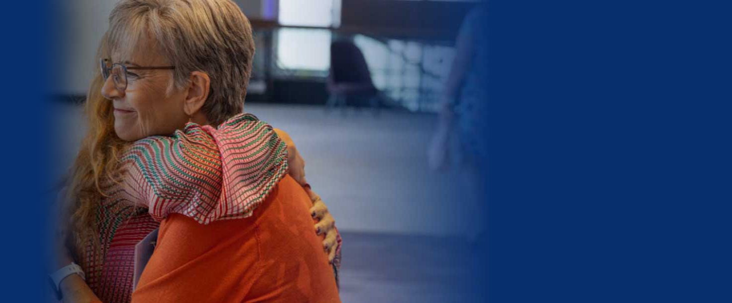 A woman hugging a child