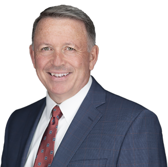 Jack McKenna, Senior Vice President and Chief Human Resources Officer,  smiling in a business suit and tie, 