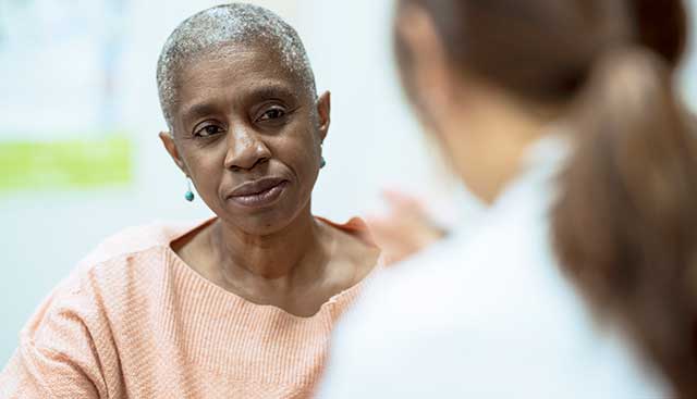 Woman talking to her doctor about bone marrow transplants for leukemia patients