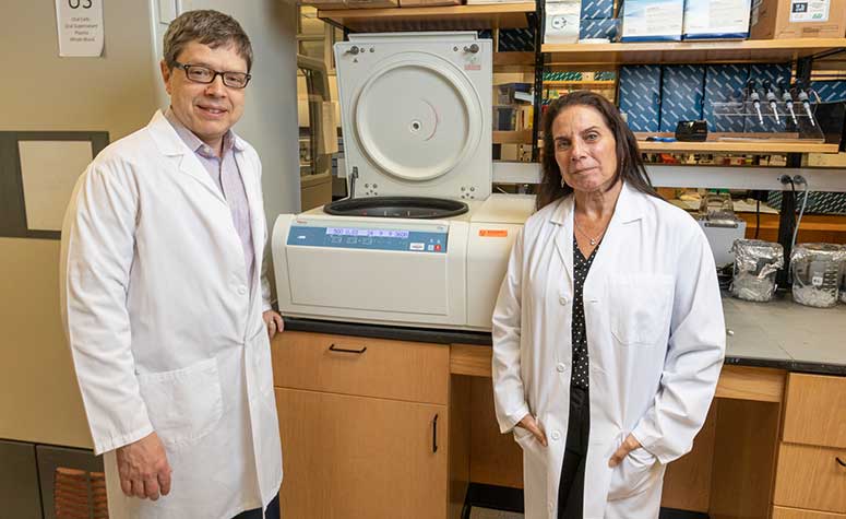 Dr. Jeffrey Lancet and Dr. Anna Giuliano in the lab at Moffitt Cancer Center