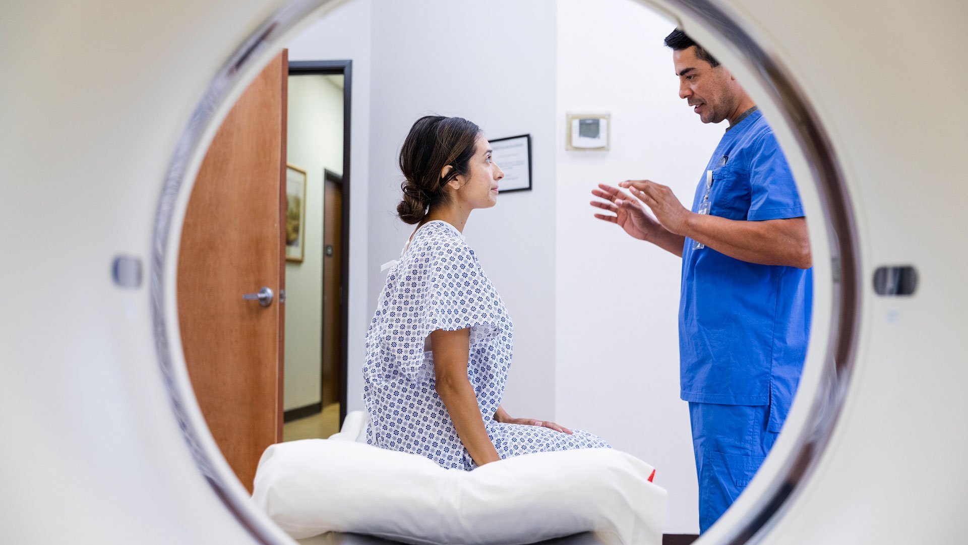 radiologist speaks with patient