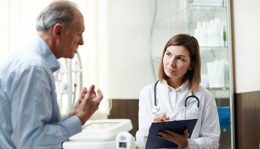 A man talking with his doctor
