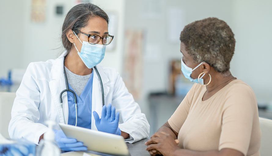 A doctor talking to a patient about pancreatic cysts