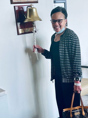 Allison rings the bell after finishing treatment