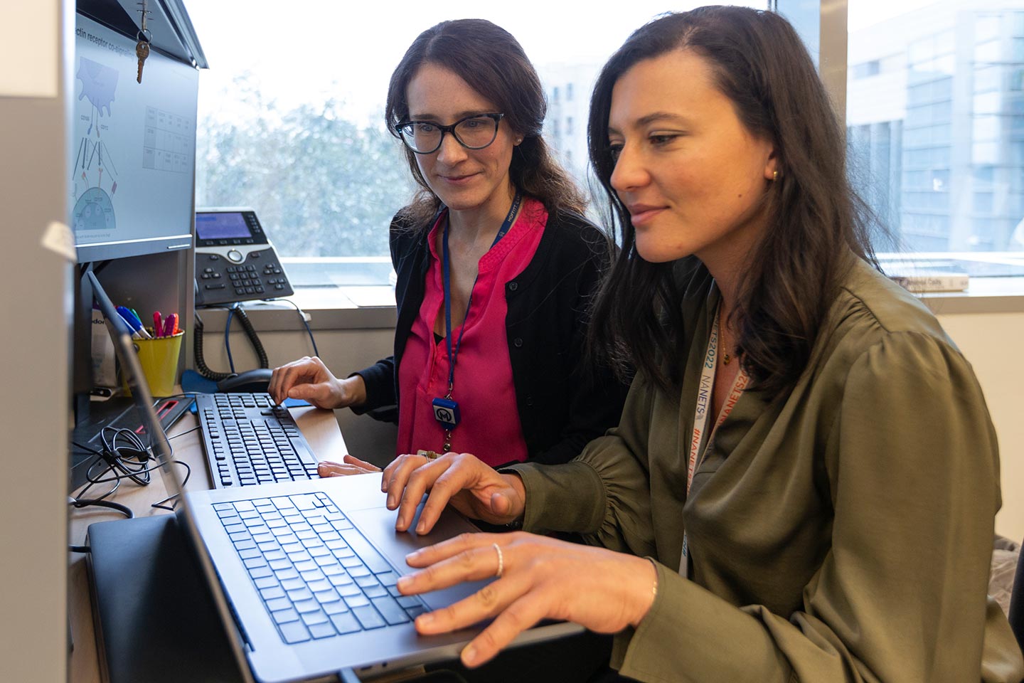researchers working at a computer