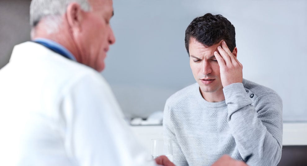 Doctor and young male with astrocytoma symptoms